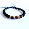 Bratara pietre semipretioase - 3 Ochi de Tigru si Onix alaturi de 6 bilute de 3 mm din Aur 14K - Snur negru rezistent si reglabil-Bratari pietre semipretioase-Personalizate >> Ocazie >> Bijuterii motivationale