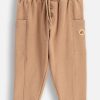 Coccodrillo pantaloni de trening din bumbac pentru bebeluși culoarea bej